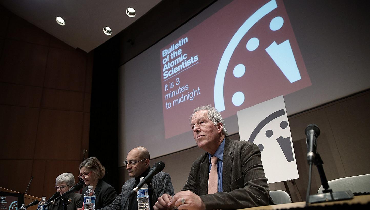 Scientists from the group Bulletin of the Atomic Scientists speak during a press conference after updating the Doomsday Clock on Jan 22, 2015 in Washington, DC.&nbsp;&nbsp;-- PHOTO: AFP&nbsp;