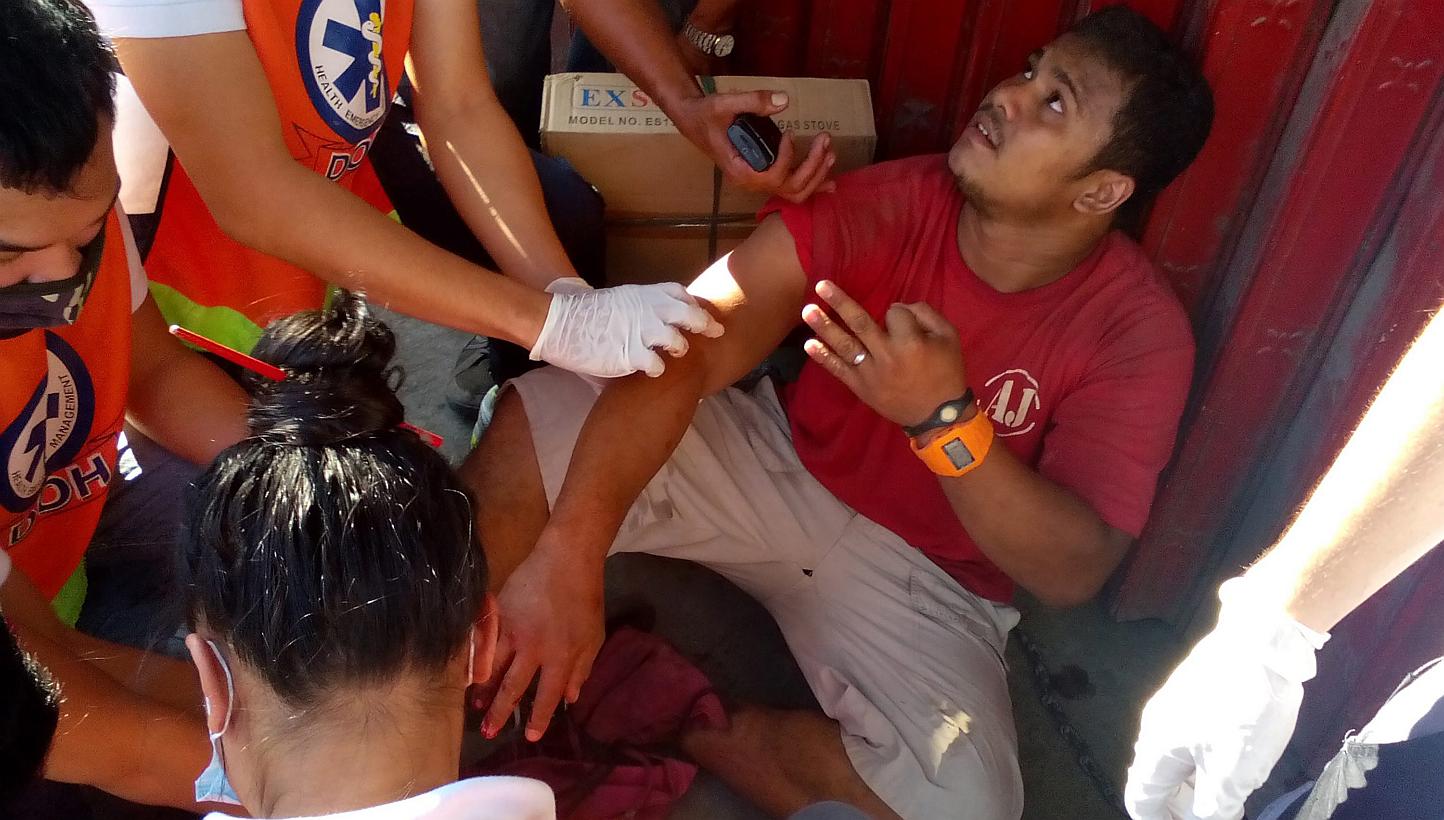 A wounded Filipino is attended by medical personnel after a blast occured at a bus terminal in Zamboanga city, Southern Philippines on Jan 23, 2015. -- PHOTO: EPA