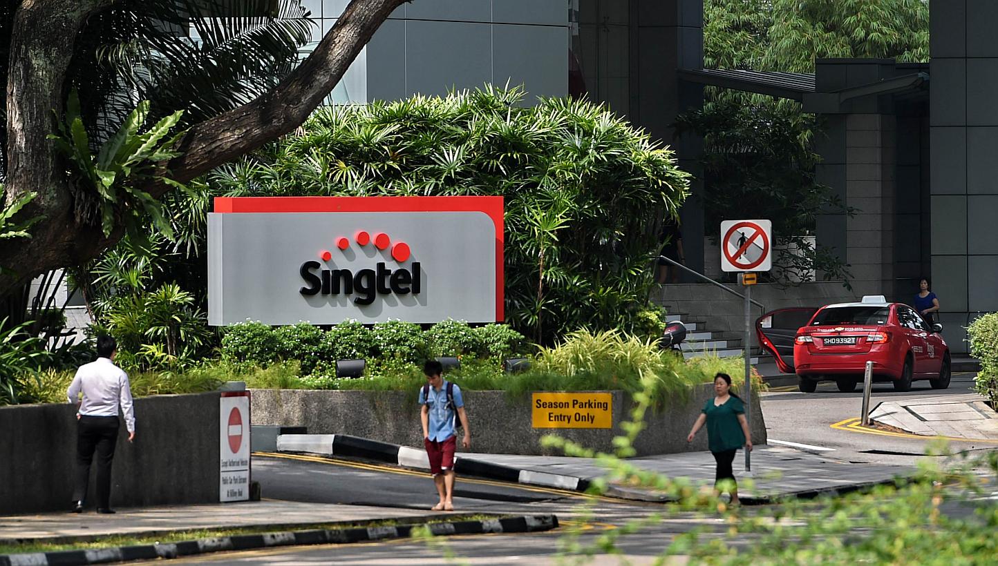 Singapore Telecom's (SingTel) new logo displayed on its building in Singapore. -- PHOTO: AFP