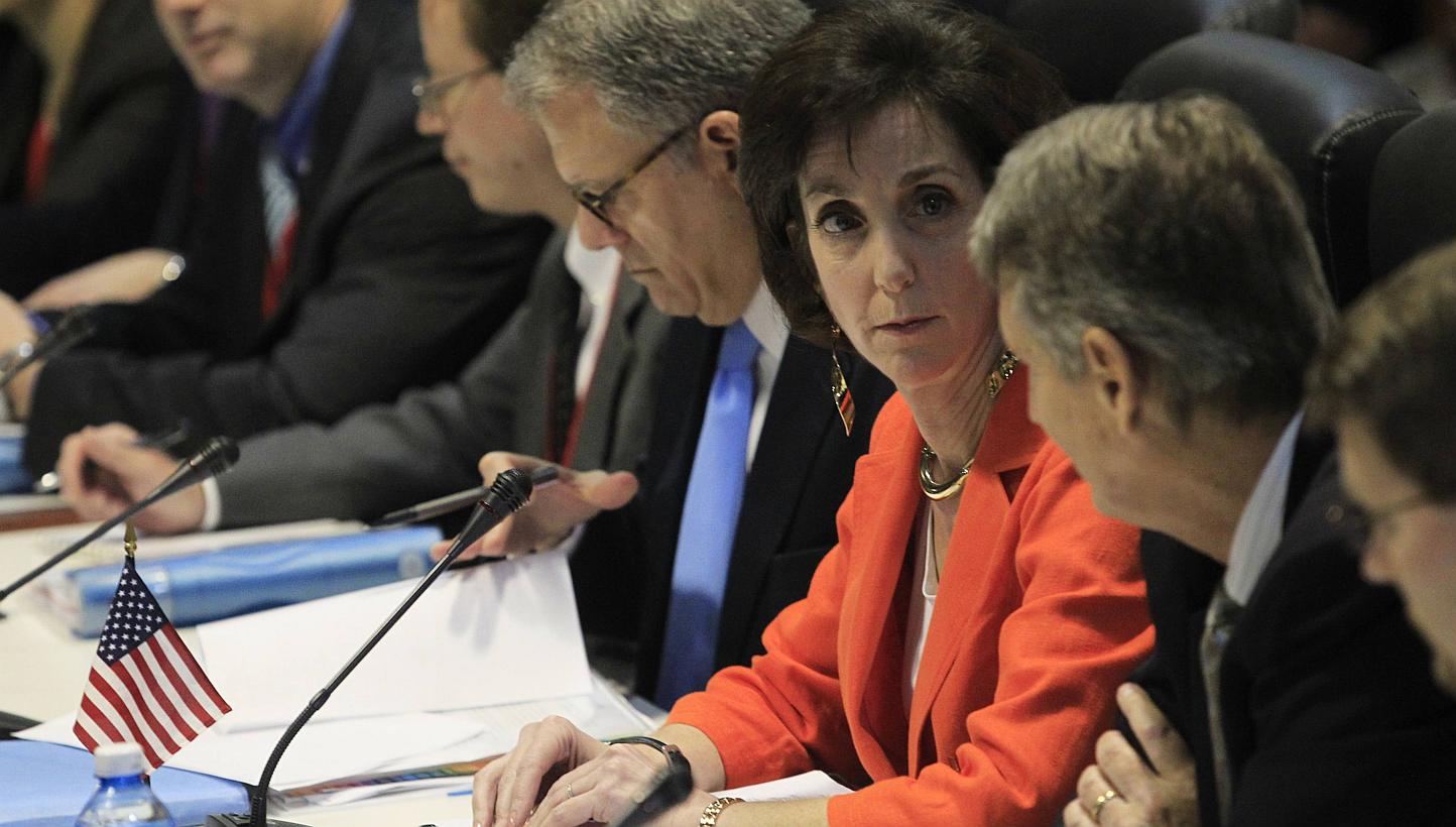US assistant secretary of state&nbsp;Roberta Jacobson (orange jacket) talks to deputy assistant secretary of state Alex Lee (second right) during negotiations to restore diplomatic ties with Cuba in Havana Jan 22, 2015. -- PHOTO: REUTERS