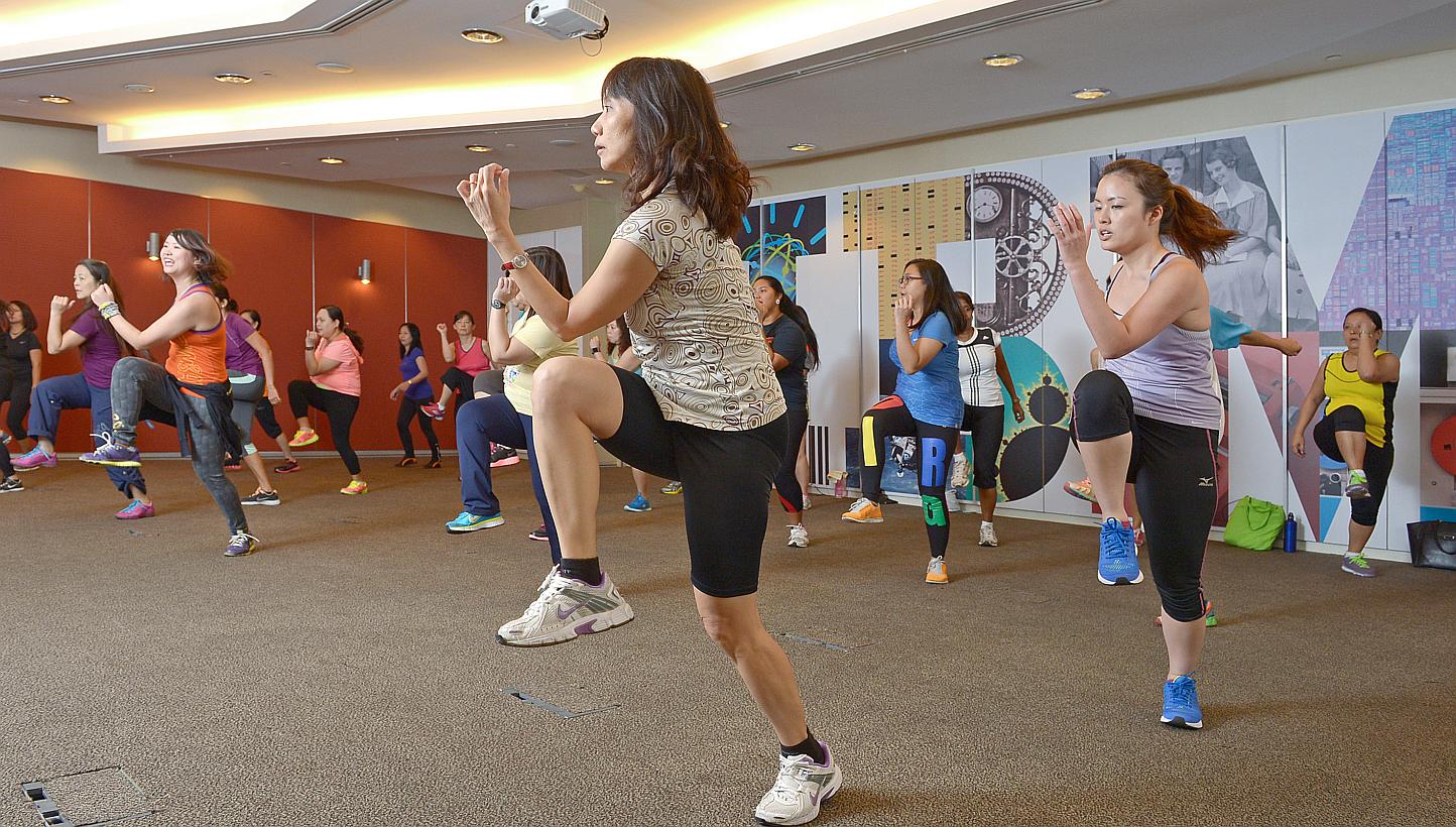 Staff of IBM at their weekly zumba class in the company auditorium. The tech corporation has also given about 2,000 staff worldwide a Fitbit, a wrist-worn fitness tracker, as part of a pilot programme. If the pilot works, IBM plans to give the device