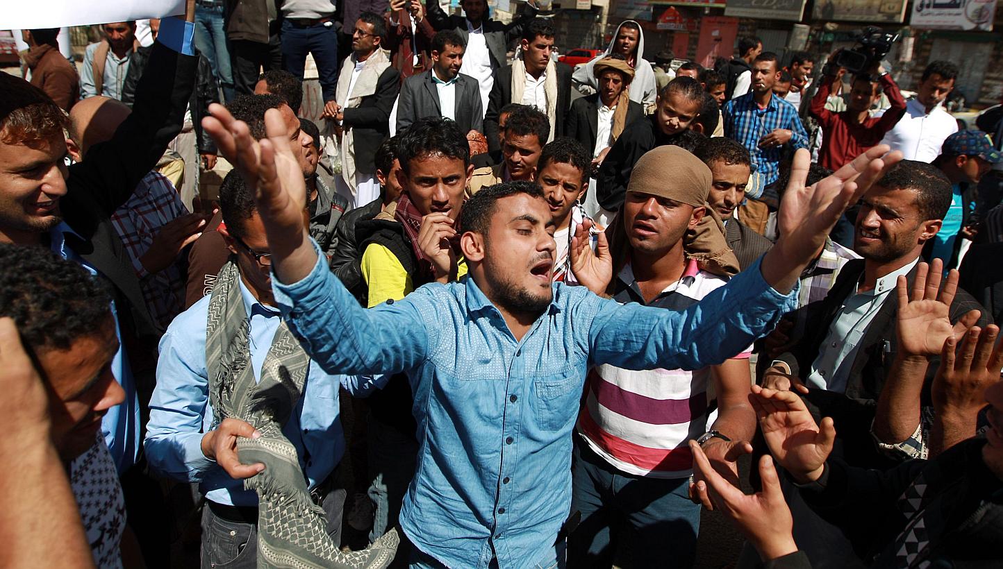 Yemeni protesters shout slogans during a rally against the control of the capital by Shi'ite Houthi rebels on Jan 23, 2015 in the capital Sanaa. -- PHOTO: AFP