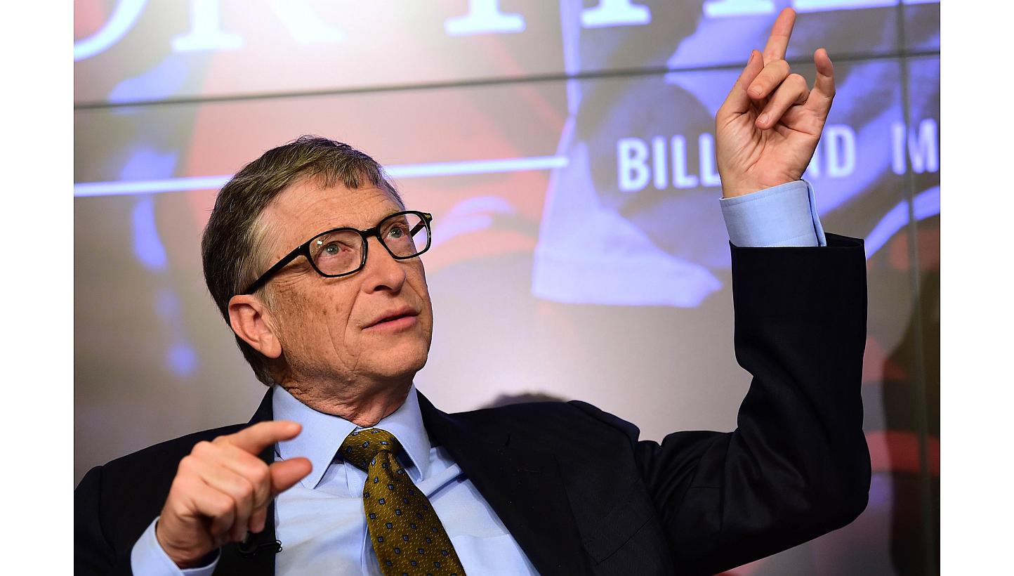 Bill Gates, founder of the Bill and Melinda Gates Foundation, gestures as he takes part in a discussion organised by British magazine The Economist about expected breakthroughs in the next 15 years in health, education, farming and banking on Jan 22,