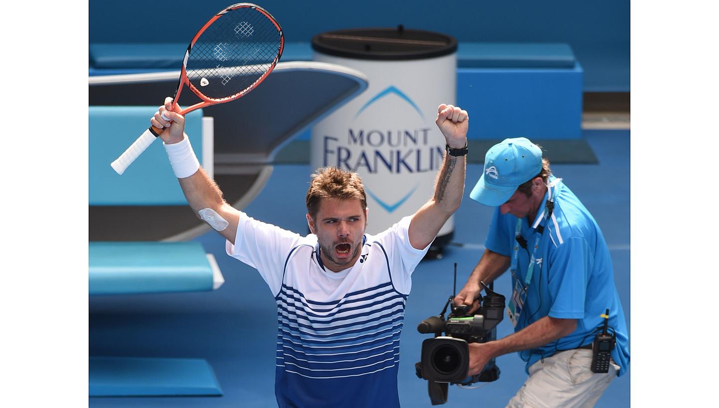 Stan Wawrinka of Switzerland celebrates his victory over Guillermo Garcia-Lopez of Spain in their men's singles match on day eight of the 2015 Australian Open tennis tournament in Melbourne on Jan 26, 2015.&nbsp;-- PHOTO: AFP