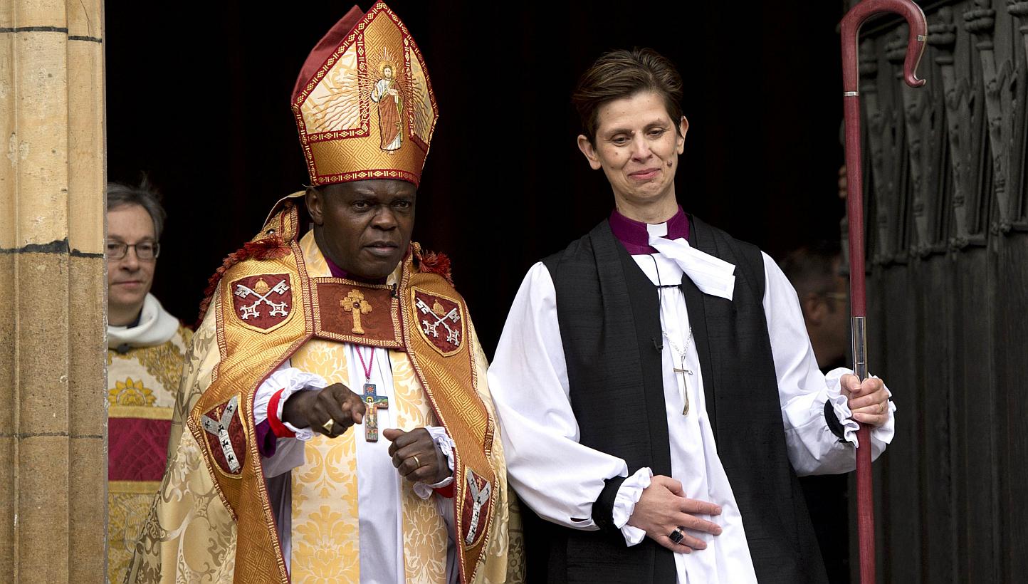 Bishop Libby Lane (R) leaves with Archbishop of York, John Sentamu, the York Minster in York, northern England, on January 26, 2015, after being consecrated as the new Bishop of Stockport. - PHOTO: AFP