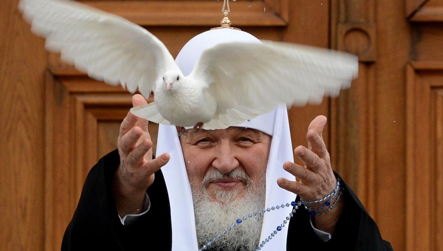 Russian Orthodox Patriarch Kirill releases a white dove to mark Annunciation Day at the Kremlin in Moscow in a file photo taken on April 7 last year. -- PHOTO: AFP