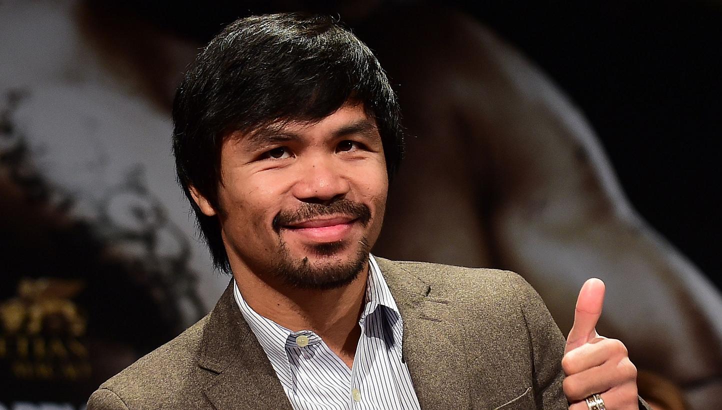 Filipino boxing star Manny Pacquiao at a press conference in Los Angeles, California, on Sept 3, 2014. Pacquiao has a plan in place if yet another bid to fight Floyd Mayweather fails - a May 30 bout, possibly against England's Amir Khan. -- PHOTO: AF