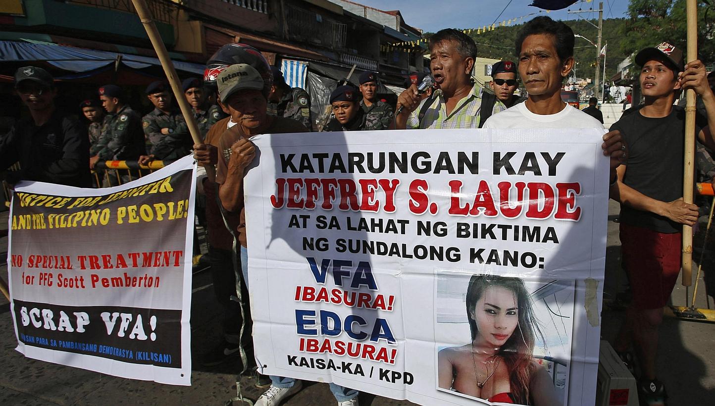 Demonstrators protest against US Marine Joseph Pemberton outside a court in Olongapo city, north-west of Manila on Dec 19, 2014. -- PHOTO: REUTERS