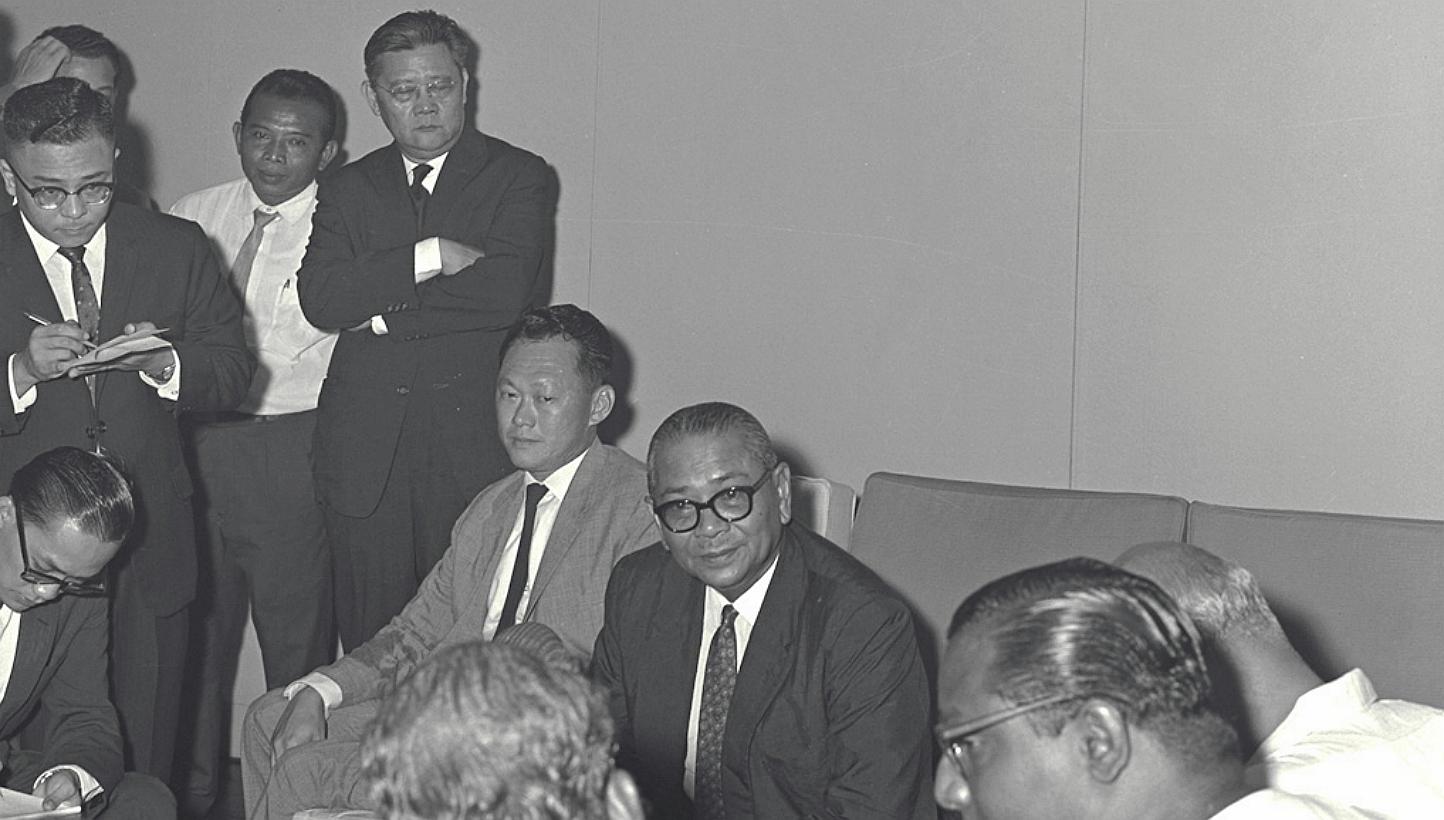 Tengku Abdul Rahman (seated, centre) giving a press conference on talks on Malaysia in 1962. Singapore's then prime minister Lee Kuan Yew is seated on the left. -- PHOTO: ST FILE 