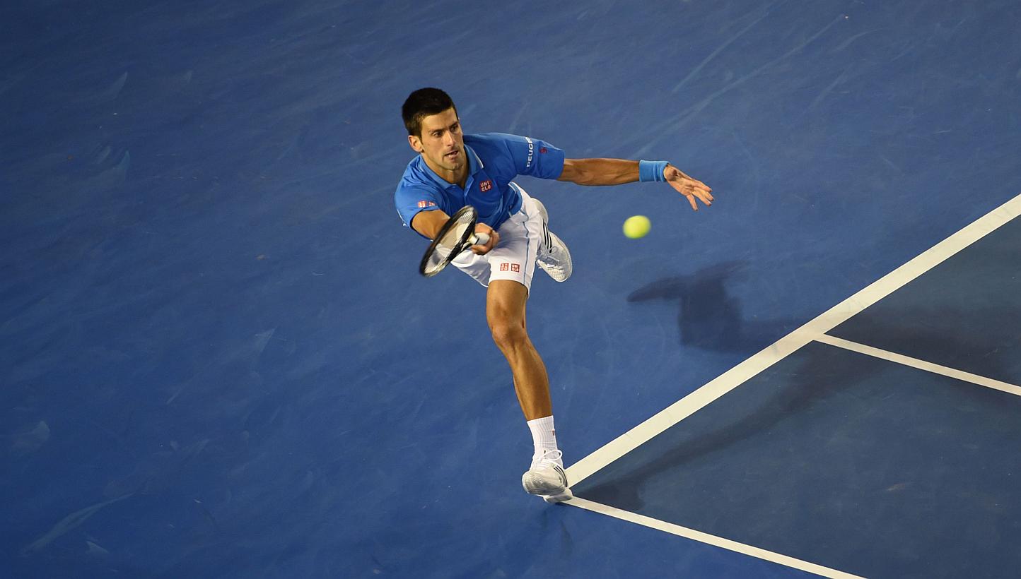 Serbia's Novak Djokovic plays a shot during his men's singles match against Canada's Milos Raonic on day ten of the 2015 Australian Open tennis tournament in Melbourne on Jan 28, 2015. -- PHOTO: AFP