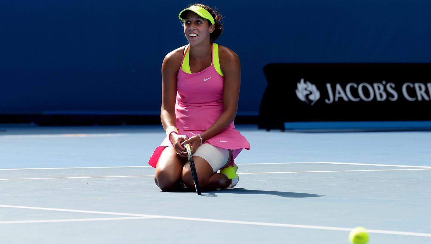 Madison Keys of the USA kneels on the ground as she plays against Serena Williams of the USA during their semifinals match at the Australian Open tennis tournament in Melbourne, Australia, Jan 29, 2015.&nbsp;Making the semi-finals of the Australian O