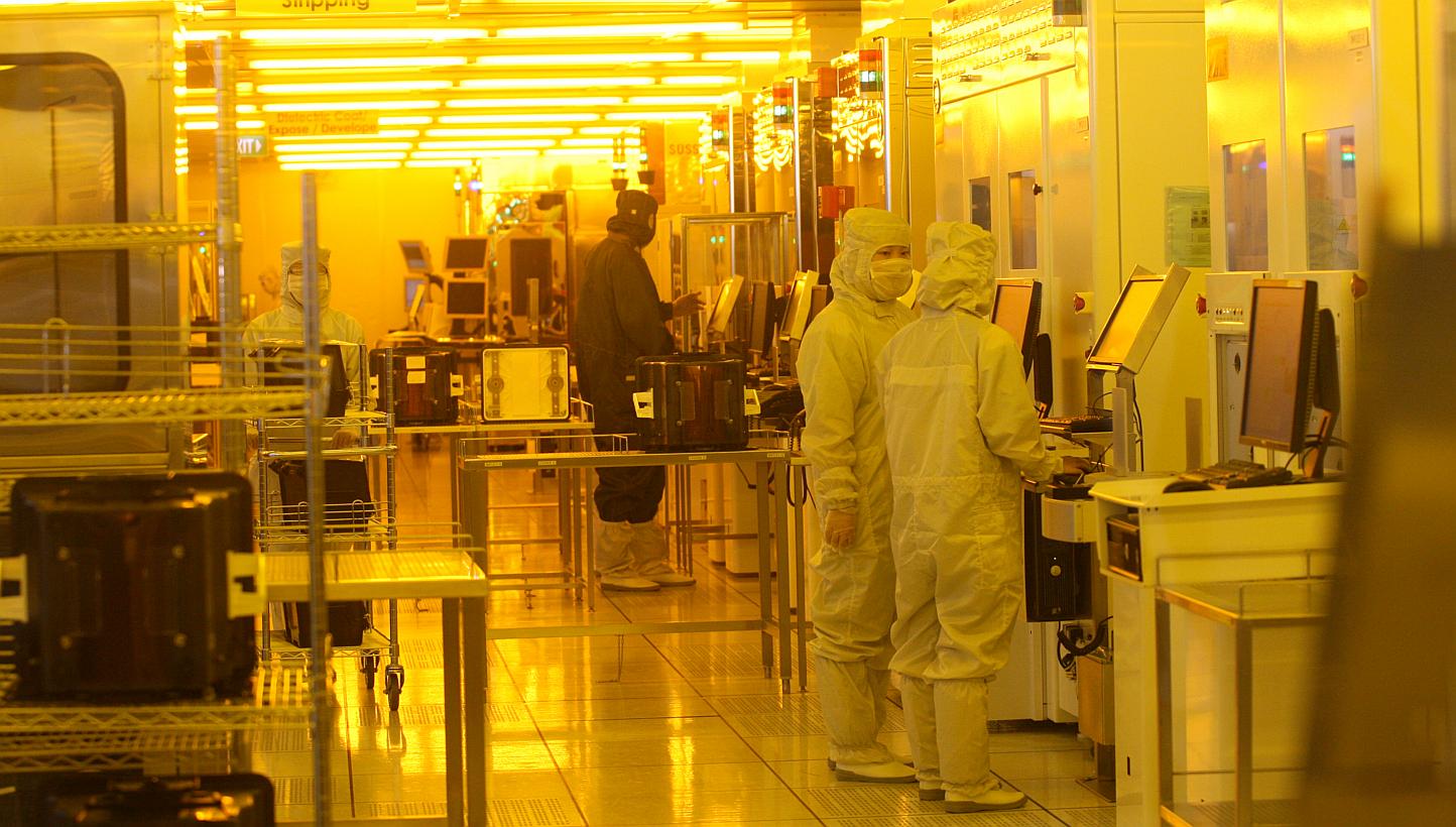 Employees at the production line at STATS ChipPAC, a mainboard-listed semiconductor chip packaging and testing firm. The semiconductor tester returned to the black in the fourth quarter, with a net profit of US$3.5 million (S$4.7 million), reversing 