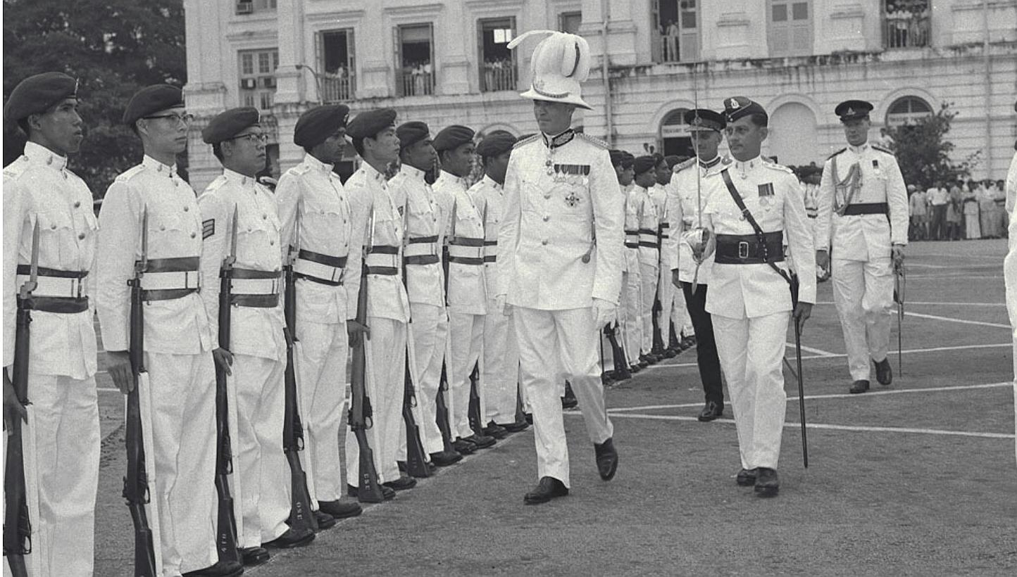 The new governor of Singapore, Sir William Goode, inspecting a guard of honour&nbsp;of the 1st Battalion Singapore Volunteer&nbsp;Corps during his installation ceremony, on Dec 11, 1957. The contributions of the Singapore Volunteer Corps will be cele