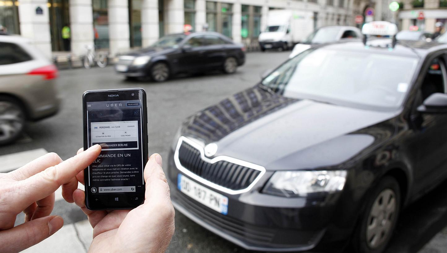 A picture shows the Uber smartphone app, used to book taxis using its service&nbsp;on Dec 10, 2014 in Paris. -- PHOTO: AFP
