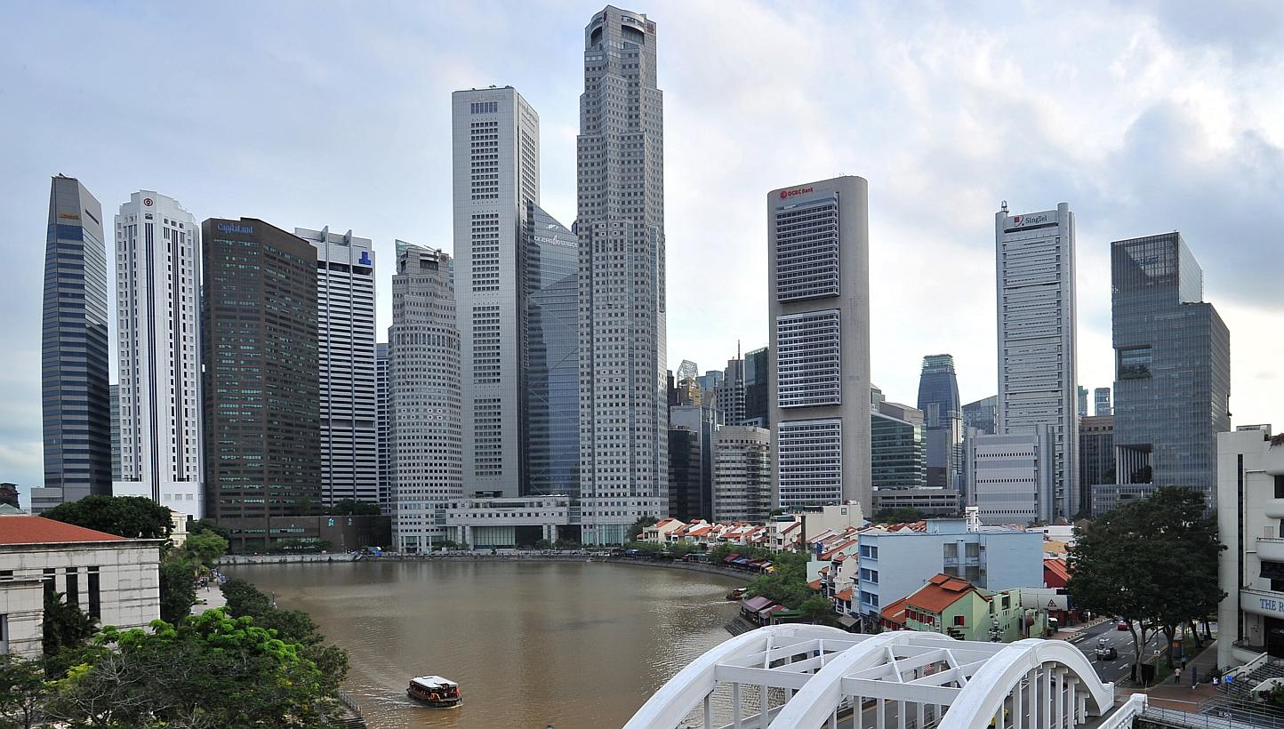 Singapore's Big Three local banks should be able to weather a significant rise in credit costs given their healthy loss-absorption buffers, says Fitch Ratings. -- PHOTO: ST FILE