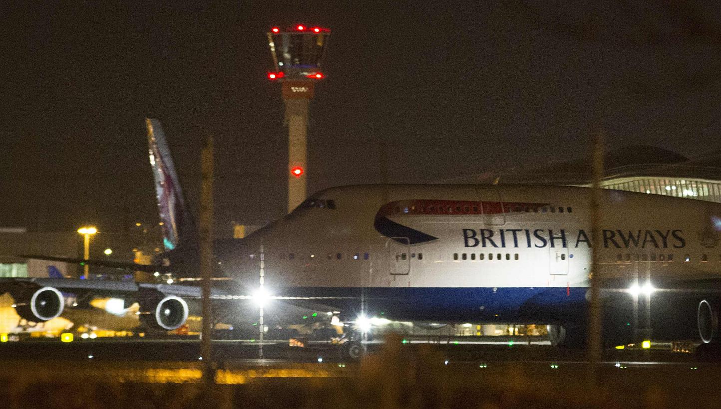 Aircraft taxi next to the control tower at Heathrow airport in London, Dec 12, 2014.&nbsp;Britain summoned the Russian ambassador on Thursday and asked him to explain why two Russian Bear long-range bombers had flown over the English channel the prev