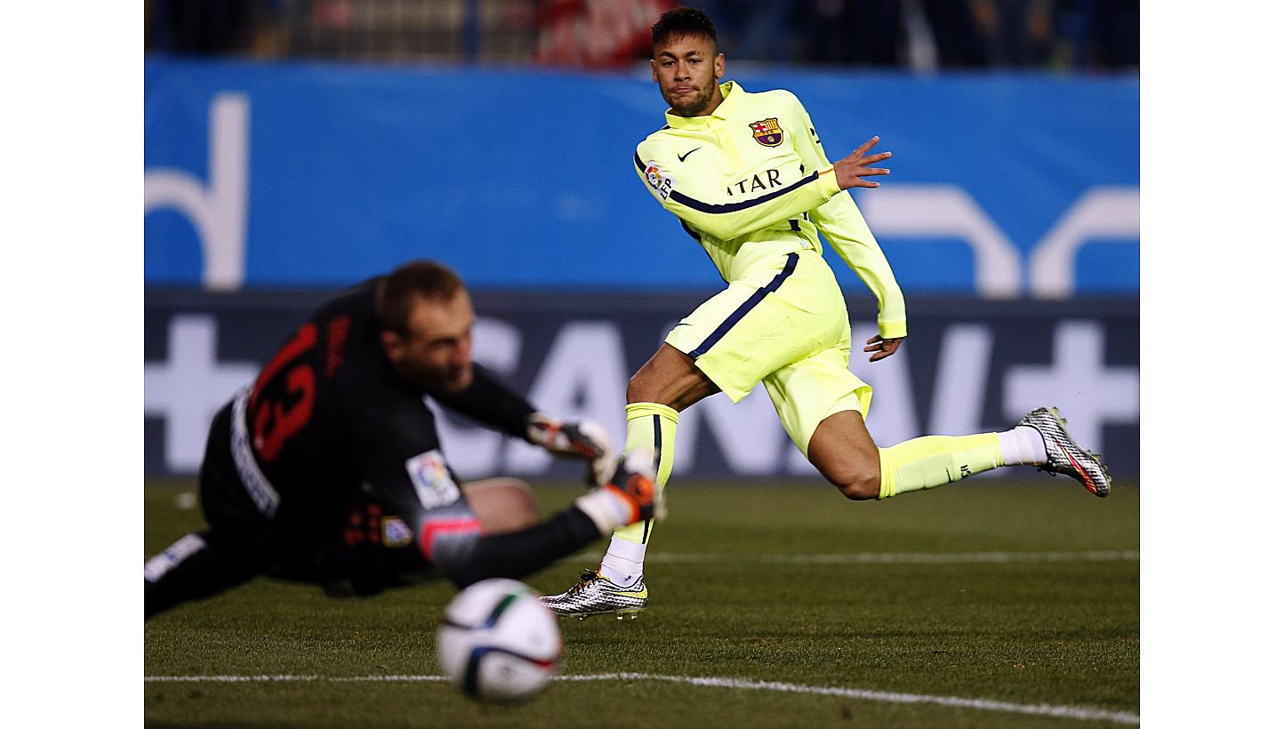 Barcelona's Neymar (right) scores past Atletico Madrid's goalkeeper Jan Oblak during their Spanish King's Cup quarterfinal second leg soccer match at Vicente Calderon stadium in Madrid on Jan 28, 2015. Barcelona boss Luis Enrique has leapt to th