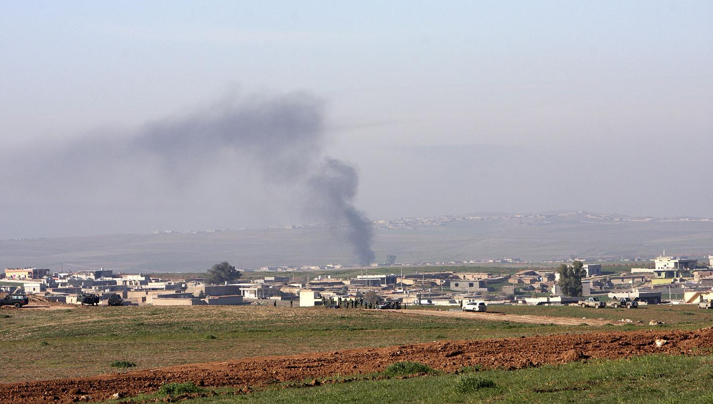 Smoke rises during clashes between Kurdish Peshmerga fighters and ISIS militants, on the outskirts of Mosul Jan 21, 2015. A US-led coalition air strike, carried out last Saturday near Mosul, killed a chemical weapons specialist with the IS in Iraq wh