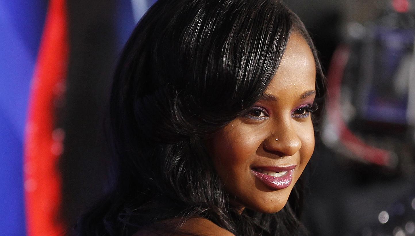 Bobbi Kristina Brown, daughter of the late singer Whitney Houston, poses at the premiere of "Sparkle" in Hollywood, California, in this file photo taken on Aug 16, 2012. She was found unconscious in a bathtub at her home on Saturday and has since bee