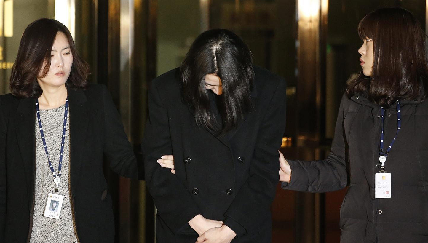Cho Hyun-ah (centre), also known as Heather Cho, daughter of chairman of Korean Air Lines Cho Yang-ho, leaves for a detention facility after a Korean court ordered her to be detained, at the Seoul Western District Prosecutor’s office on Dec 30, 201