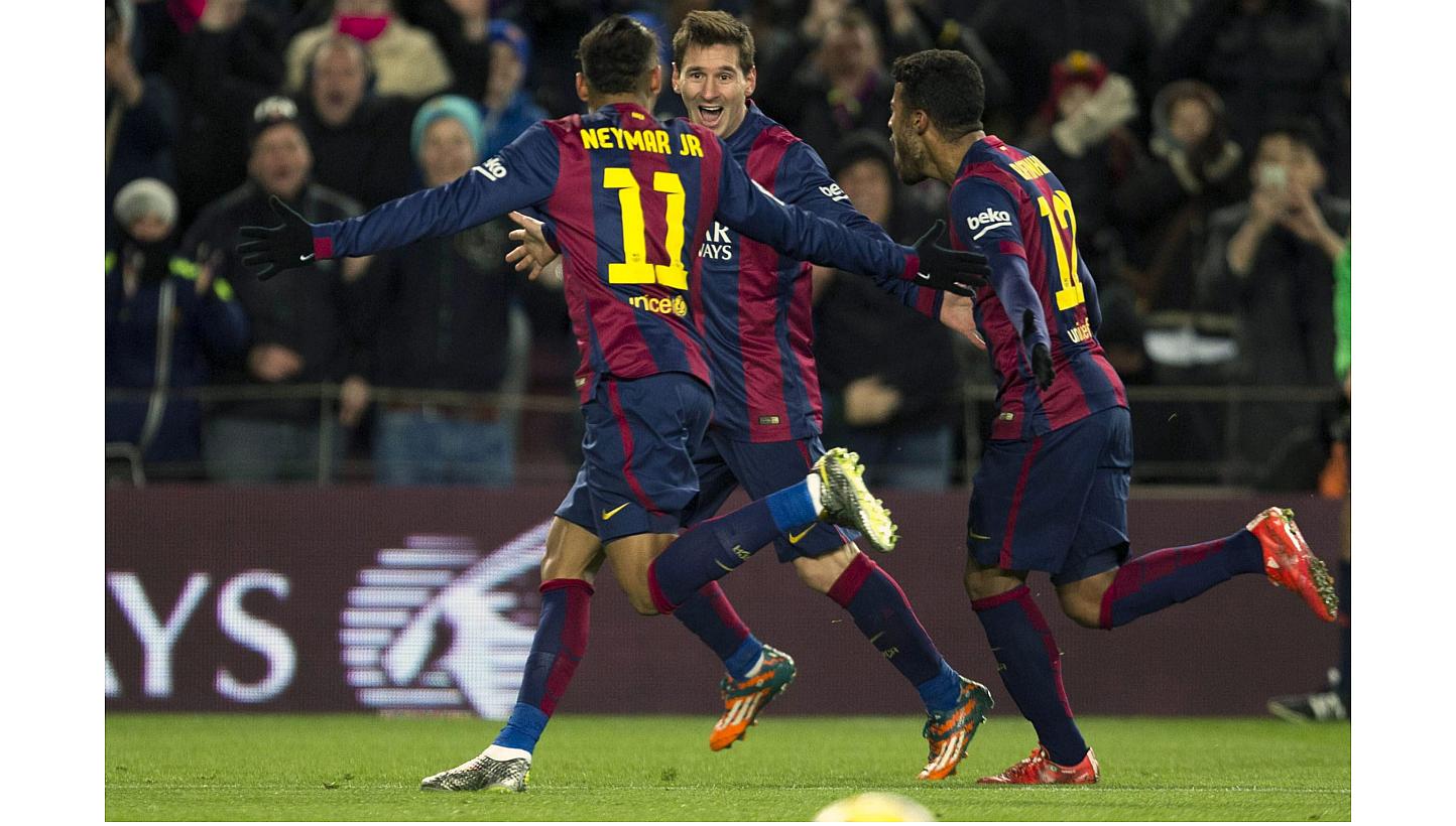 FC Barcelona's Lionel Messi (centre) celebrates with Neymar (left) and Rafinha (right) after scoring the 3-2 leading against Villarreal during the Spanish Primera Division soccer match between FC Barcelona and Villarreal CF at Camp Nou in Barcelona,