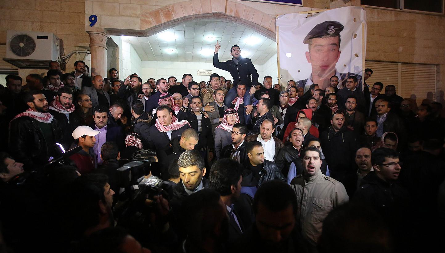 Supporters and family members of Jordanian pilot First Lieutenant Maaz al-Kassasbeh, 26-year-old, gather following his reported killing, at the Karak tribal gathering chamber or Diwan, in the Jordanian capital Amman on Feb 3, 2015. -- PHOTO: AFP