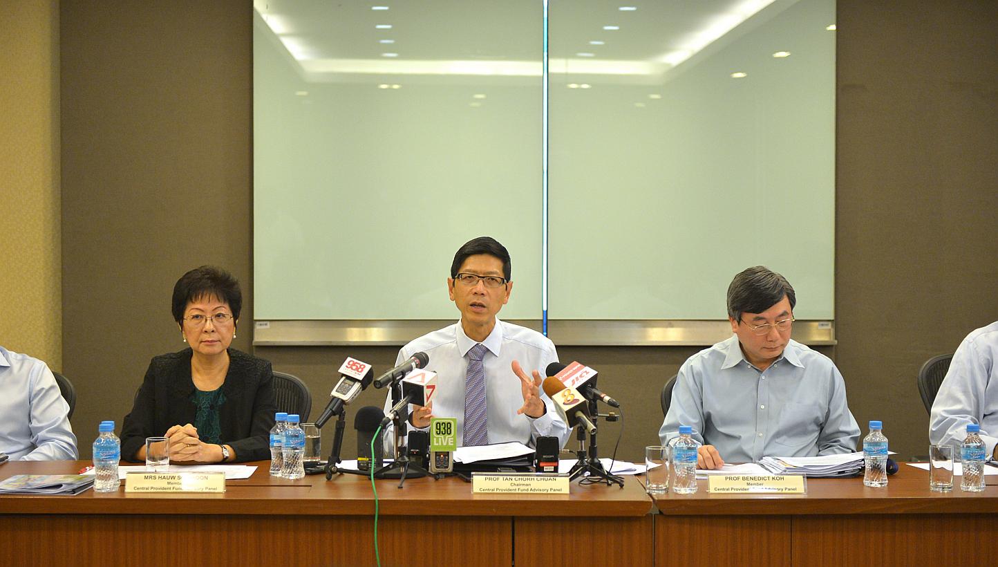 Professor Tan Chorh Chuan (centre) chairing the CPF Advisory Panel press conference to announce its recommendations on how to make the CPF system more flexible on Feb 4, 2015, at the Ministry of Manpower. -- ST PHOTO: ALPHONSUS CHERN