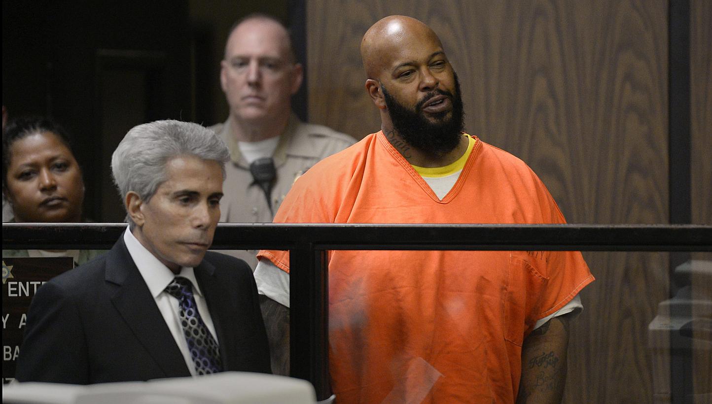 US rapper/music producer Marion 'Suge' Knight (right), next to his attorney David E Kenner, is arraigned on murder charges in Superior Court in Compton, California on Monday. Knight is accused of murder in the hit-and-run death of Terry Carter. Knigh
