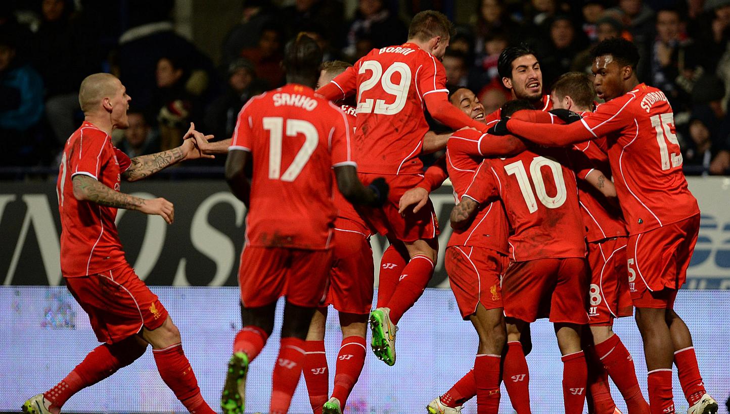 Liverpool's players celebrate after Phillipe Coutinho (10) scored the winning goal during the FA Cup fourth round replay match between Bolton Wanderers and Liverpool in Bolton, Britain on Feb 4, 2015. Premier League giants Liverpool on Thur