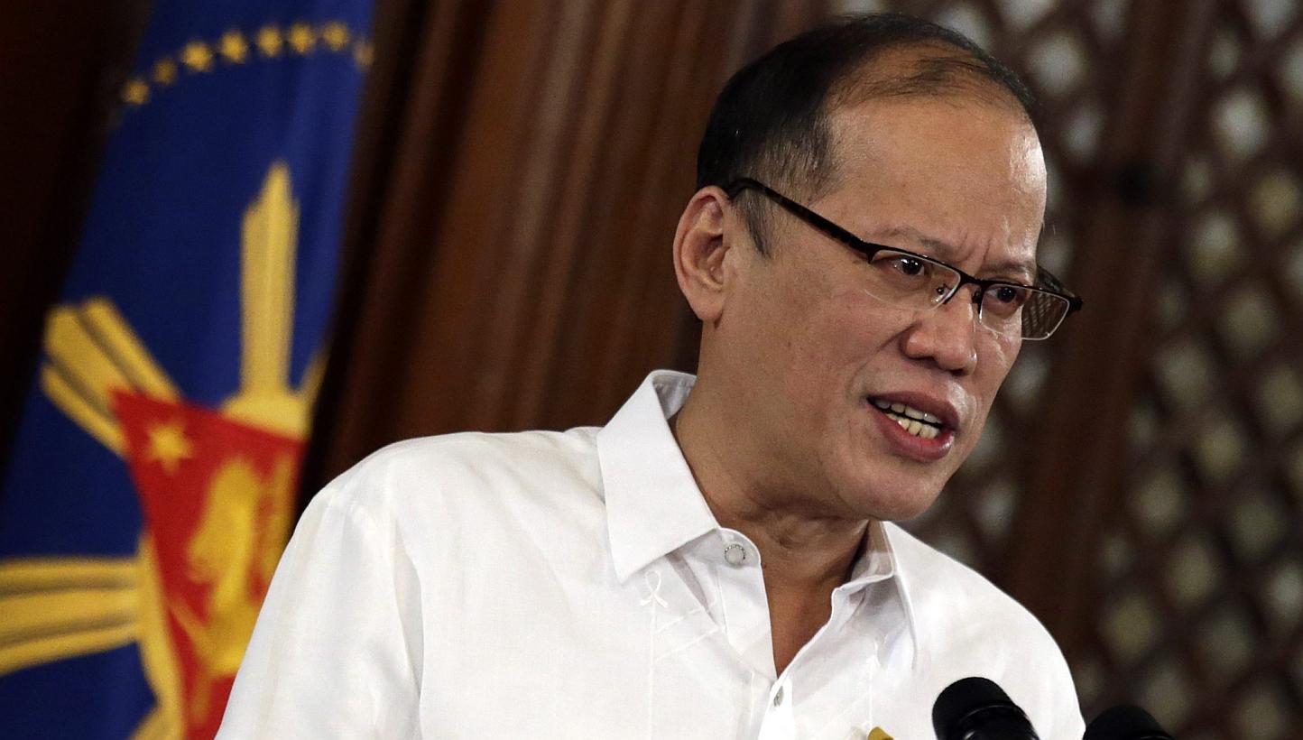 Philippine President Benigno Aquino III reacts after he delivers his second televised address regarding the killing of 44 police officers in a clash in southern Philippines inside the Malacanang Presidential Palace in Manila, Philippines on Feb