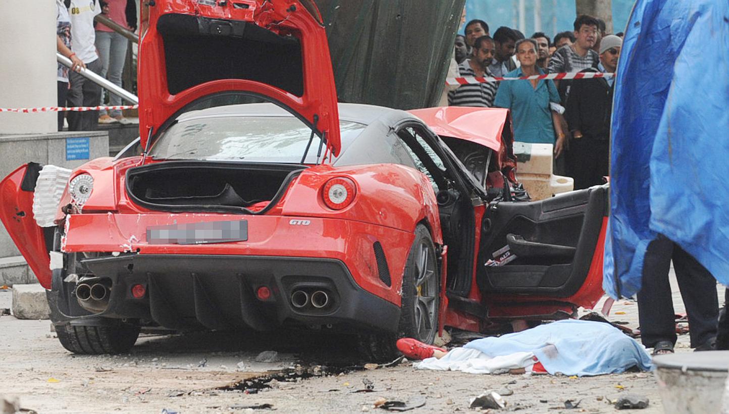 The parents of the Japanese woman who was killed in a shocking car crash along Rochor Road in 2012 have reached a settlement with the insurer of Ferrari driver Ma Chi, who crashed his car into a taxi that Ms Ito was in. -- PHOTO: LIANHE WANBAO