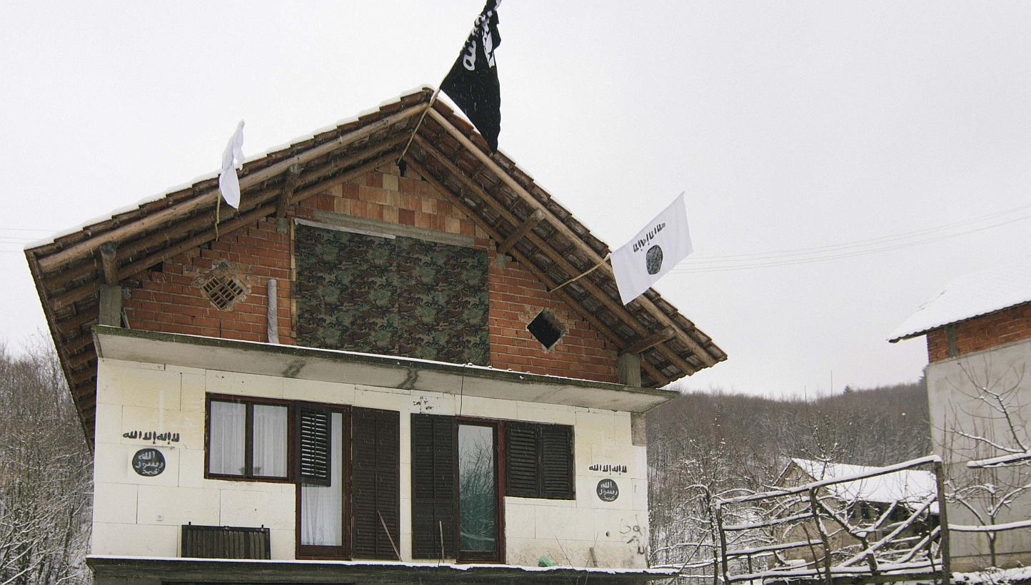 A house in the Bosnian village of Gornja Maoca decorated with Islamic State flags, Jan 26, 2015. -- PHOTO: REUTERS 