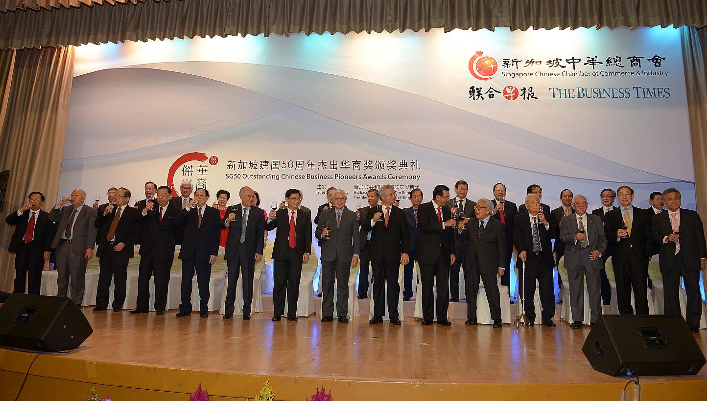 Group shot of the Pioneer Chinese businessmen giving a toast. -- ST PHOTO: DESMOND WEE