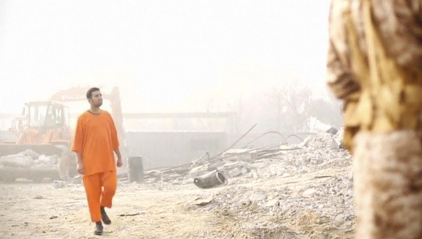 A still image from a video made available on social media purportedly shows Jordanian pilot Muath al-Kasaesbeh in an undisclosed location. Lieutenant Kasaesbeh was burned alive by ISIS militants, allegedly in retaliation for dropping a bomb from his