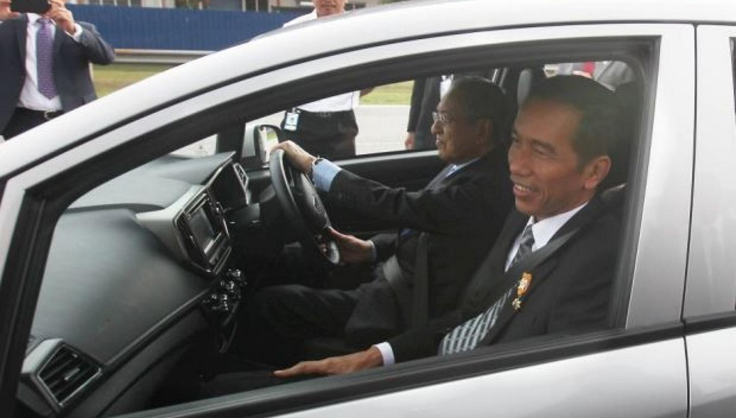 President of indonesia Joko Widodo taking a ride in the new proton Iriz driven by Proton Chairman Tun Mahathir Mohamad during his visit to the Proton centre of Excellence in Shah Alam. -- PHOTO: THE STAR/ ASIA NEWS NETWORK