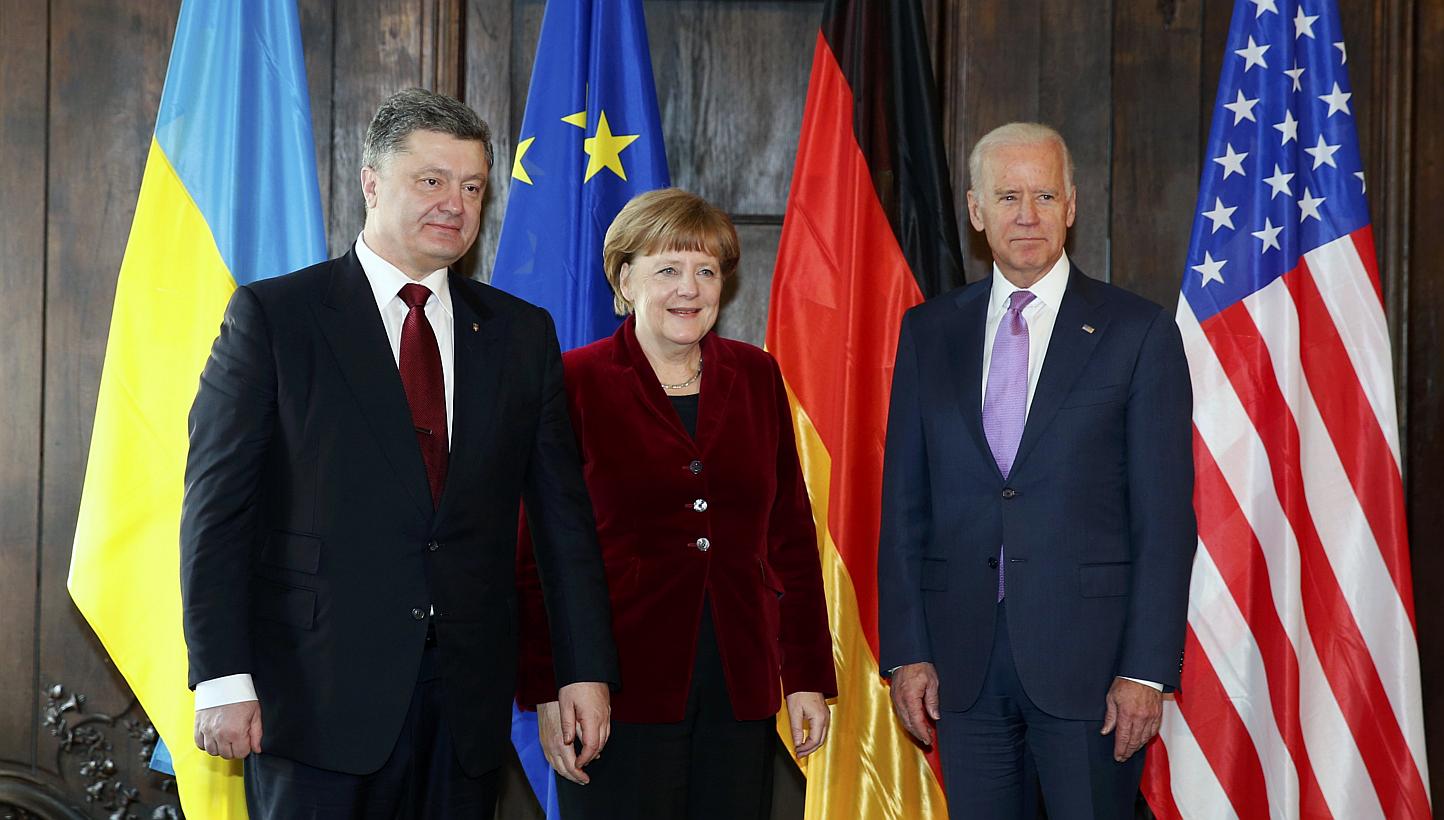 Ukraine's President Petro Poroshenko (left), German Chancellor Angela Merkel and US Vice-President Joe Biden pose during the Munich Security Conference on Feb 7, 2015. -- PHOTO: REUTERS