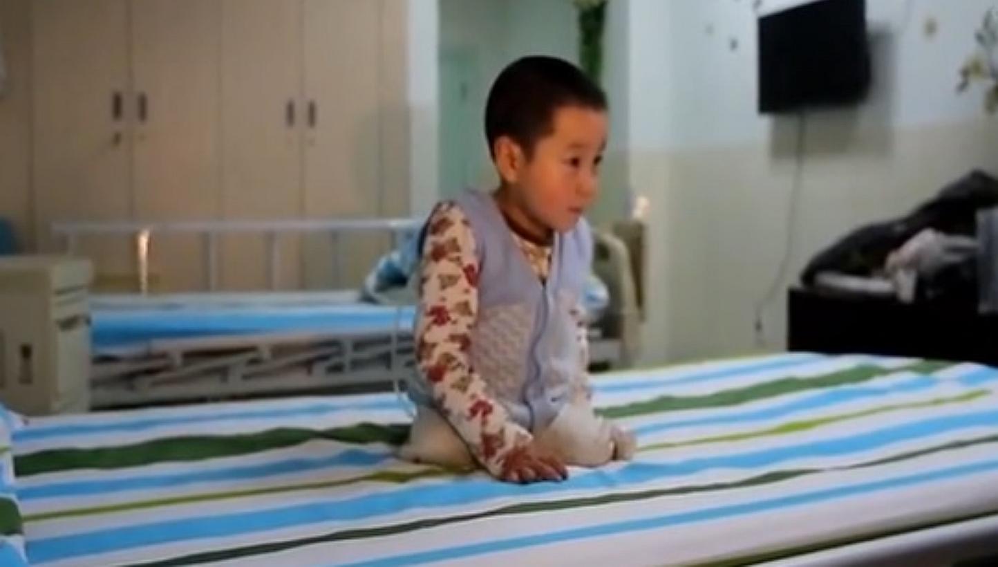 Xiao Feng, as the boy is affectionately known in Chinese media, was filmed prancing and flipping on his hospital bed in the central Hubei province using his arms and the stumps of what used to be his legs. -- PHOTO: YOUTUBE SCREENGRAB