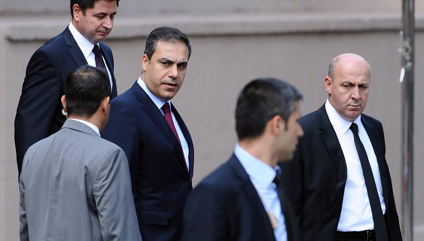 A 2012 file photo made available on Feb 7, 2015, shows the head of Turkey's intelligence service, Hakan Fidan (centre) in Ankara, Turkey. -- PHOTO: EPA