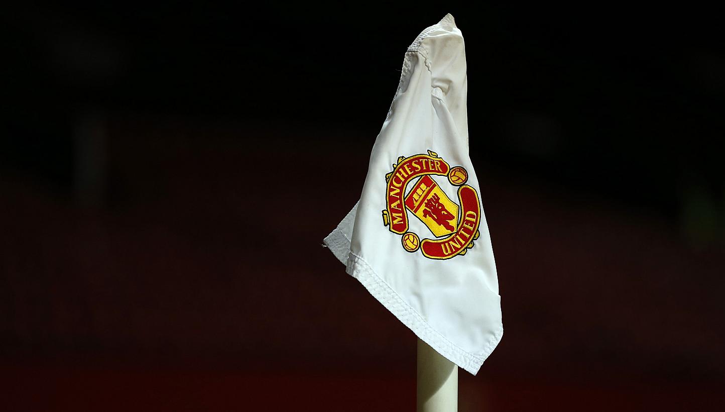 The Manchester United club logo is seen on a corner flag on the Old Trafford pitch.&nbsp;A player from from the club was allegedly filmed by team-mates as he and a woman engaged in a "sex act" in the toilets of a nightclub. -- PHOTO:&nbsp;REUTERS