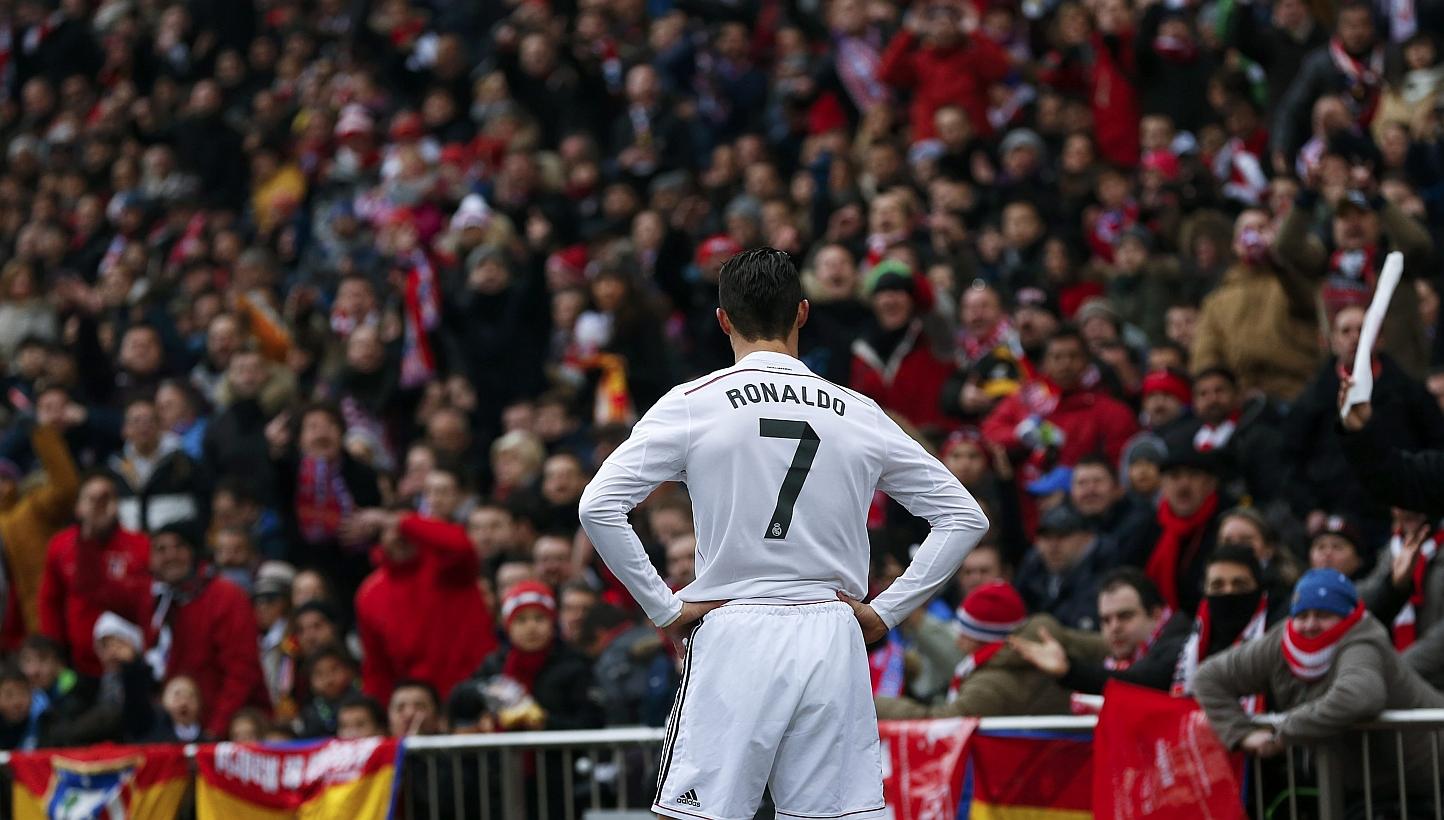 Real Madrid's Cristiano Ronaldo reacts during their Spanish first division soccer match against Atletico Madrid at the Vicente Calderon stadium in Madrid, on Feb 7, 2015. The football star drew criticism in the changing room by partying for his 30th