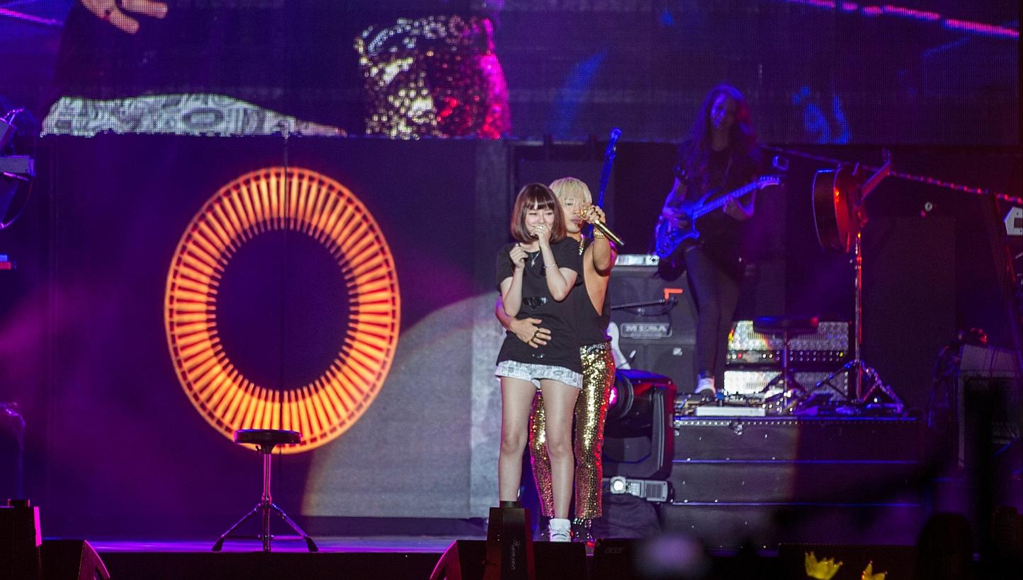 Korean pop star Taeyang serenading a fan onstage during the Singapore leg of his first solo world tour at the Singapore Expo Hall on Feb 8, 2015. -- PHOTO: NICOLE QUEK 