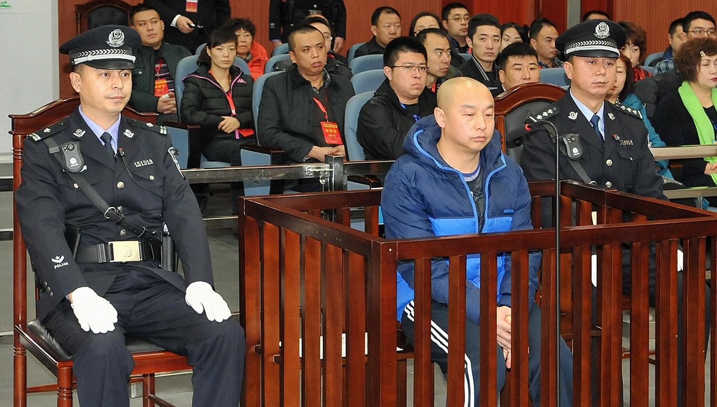 Zhao Zhihong (centre), a man who confessed to murdering a woman in China 18 years ago, went on trial in the Intermediate People's Court in Hohhot, north China's Inner Mongolia region on Jan 5, 2015, three weeks after a court cleared the teenager who 