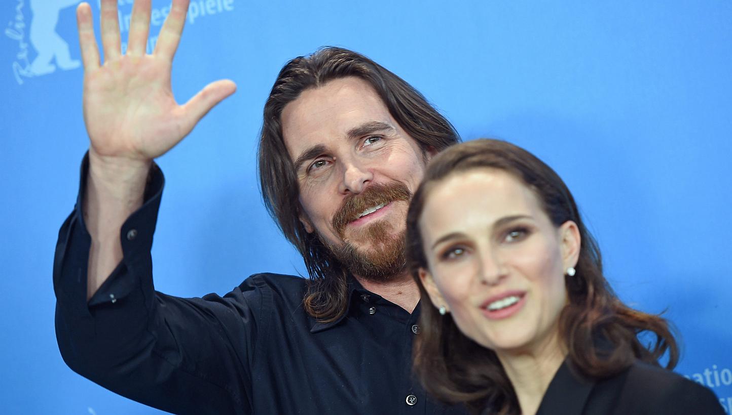 US actress Natalie Portman and British actor Christian Bale pose during a photocall for Knight of Cups at the 65th annual Berlin Film Festival on Sunday. The movie is presented in the Official Competition of the Berlinale. -- PHOTOS: EPA