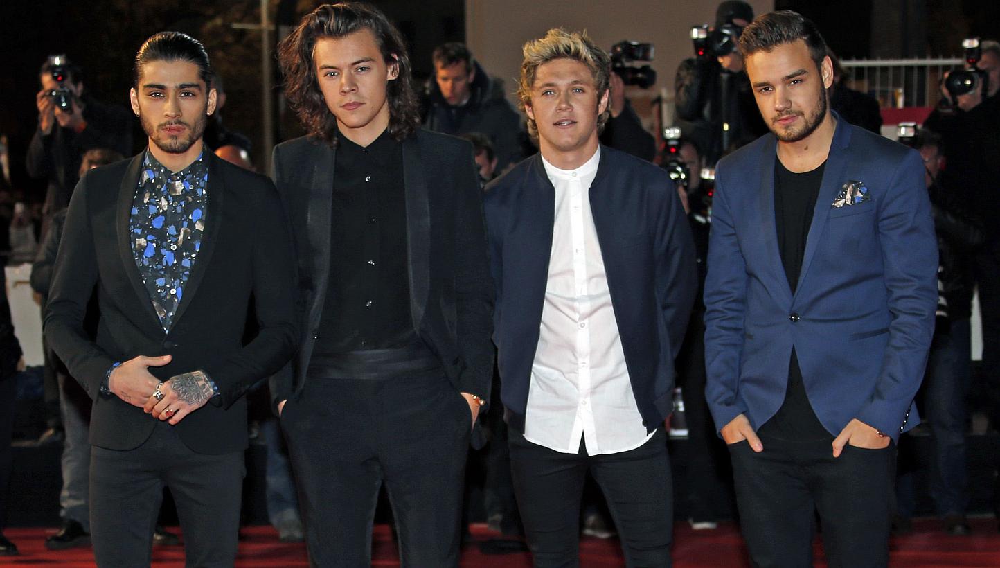 British boy band One Direction (from left) Zayn Malik, Harry Styles, Niall Horan and Liam Payne arriving at the NRJ Music Awards ceremony at the Festival Palace in Cannes on Dec 13, 2014. -- PHOTO: REUTERS