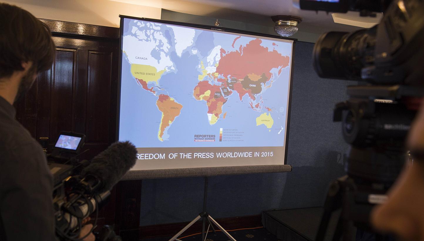Journalists filming a map showing the World Press Freedom Index 2015 during a press conference at the National Press Club in Washington, DC, on Feb 11, 2015. -- PHOTO: AFP