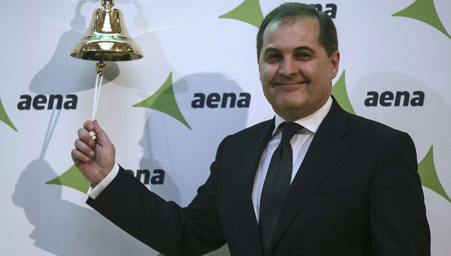 Jose Manuel Vargas Gomez, president of Spanish airports group Aena, poses ringing a bell during their stock market debut at the bourse in Madrid Feb 11, 2015. -- PHOTO: REUTERS