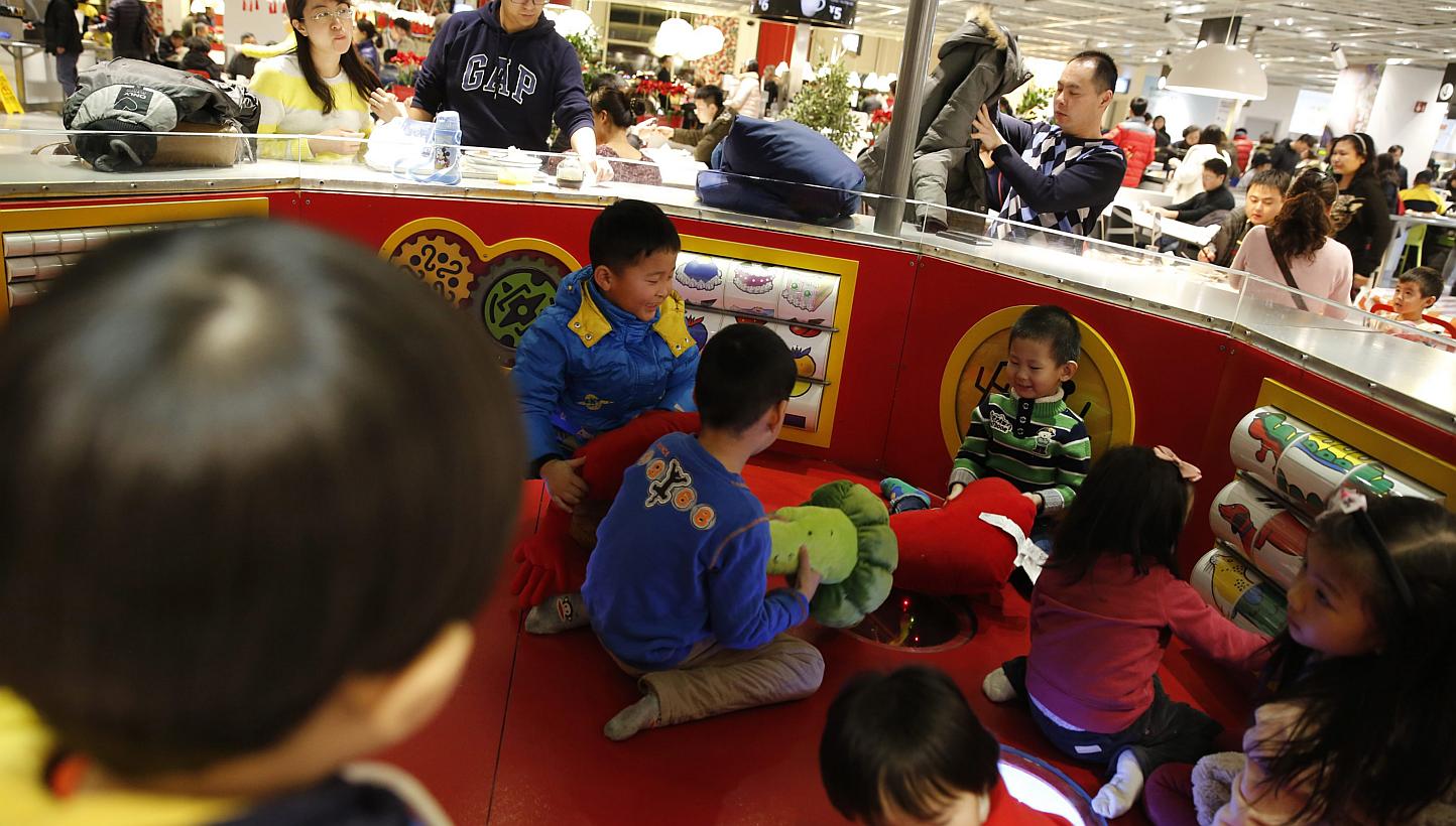 Children playing at a furniture shop in Beijing on Feb 3, 2015. -- PHOTO: EPA