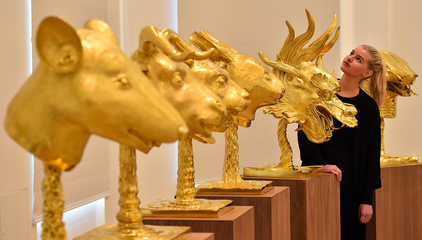 A set of 12 gold-plated animal head sculptures by China's Ai Weiwei sold for £2.8 million (S$5.8 million) at auction on Feb 12, 2015, setting a new record for the dissident artist's work. -- PHOTO: AFP