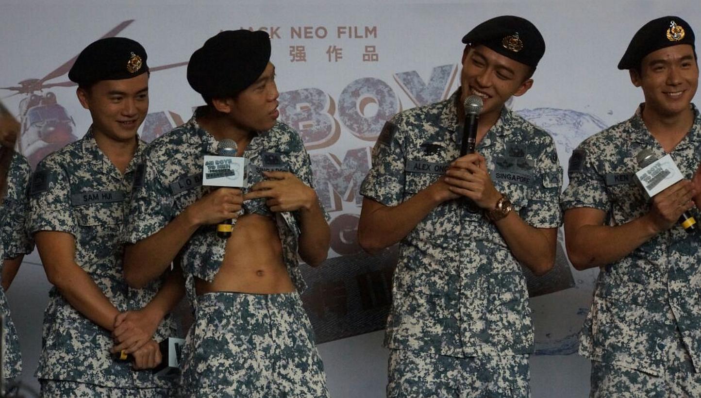 Ah Boy actor Wang Weiliang (second from left) shows off his abs, next to him on the right is Tosh Zhang, and Joshua Tan. -- ST PHOTO: GWENDOLYN NG &nbsp;