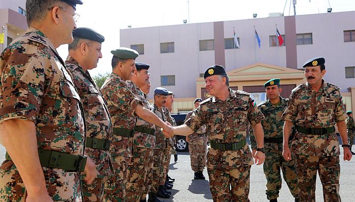 A handout picture released by the Jordanian Royal Palace shows Jordan's King Abdullah II greeting members of the Jordanian Armed Forces in Amman on Feb 12, 2015. -- PHOTO: AFP